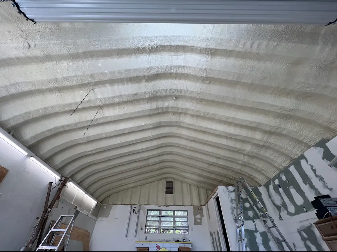 Spray polyurethane foam applied to the underside of a metal roof deck in Four Square Mile